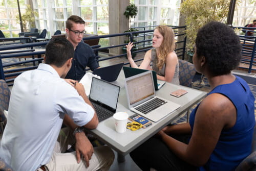 Students collaborating around a table